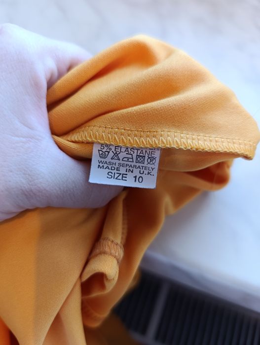 Pomarańczowa narzutka żakiecik