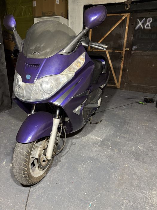 \ Piaggio X8 125 /