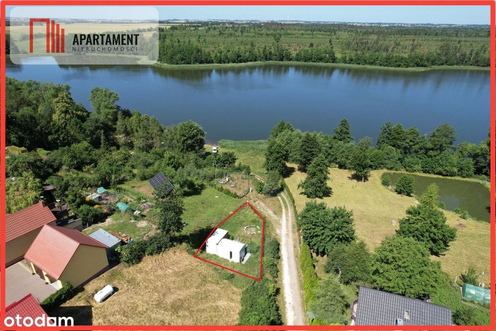 Działka nad jeziorem Raciąskim z domkiem.
