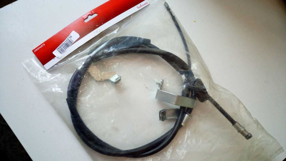 Трос стояночного тормоза ручника левый hyundai tucson 597602E500