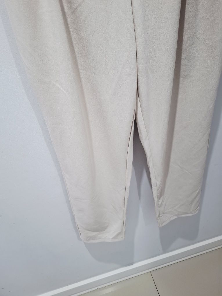 Nowe beżowe spodnie casual reserved l 40