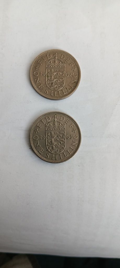 11 moedas de one shilling, escudo Inglês