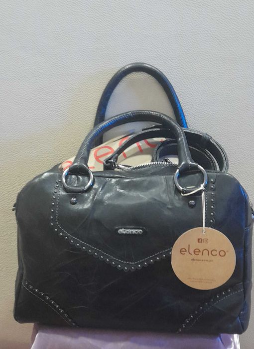 Mala em pele nova com etiqueta de marca Elenco