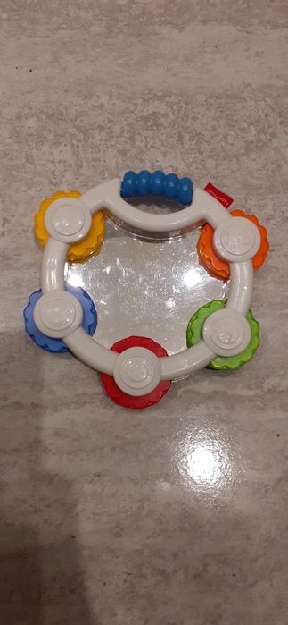 Grzechotka zabawka tamburyn Fisher Price, kółeczkami kolorowymi dziec