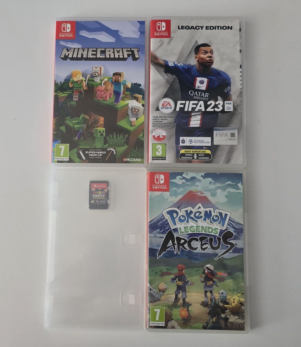 Nintendo Switch OLED + stacja dokująca + pad Cobra + pokrowiec + 4 gry