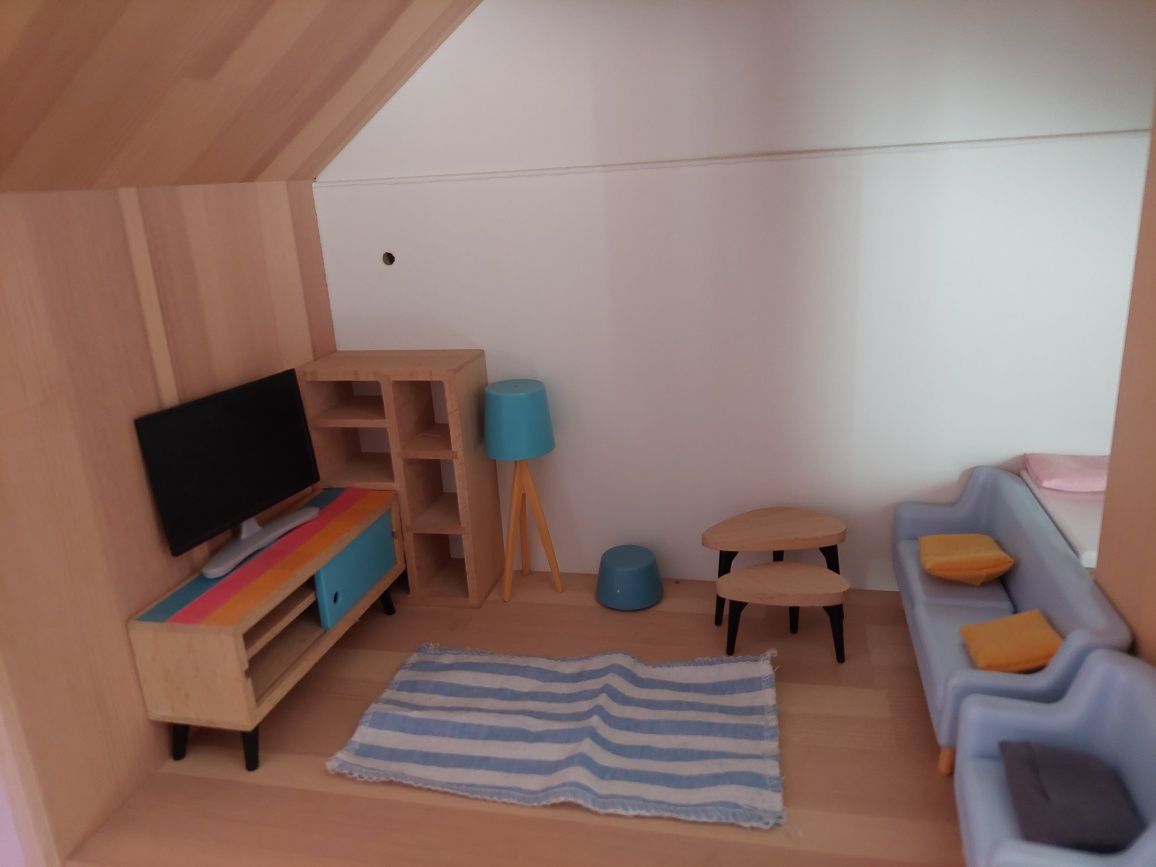 Casa de madeira com mobília