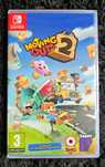 Nintendo Switch Team 17 Moving Out 2 + DLC, versão PT, selo IGAC