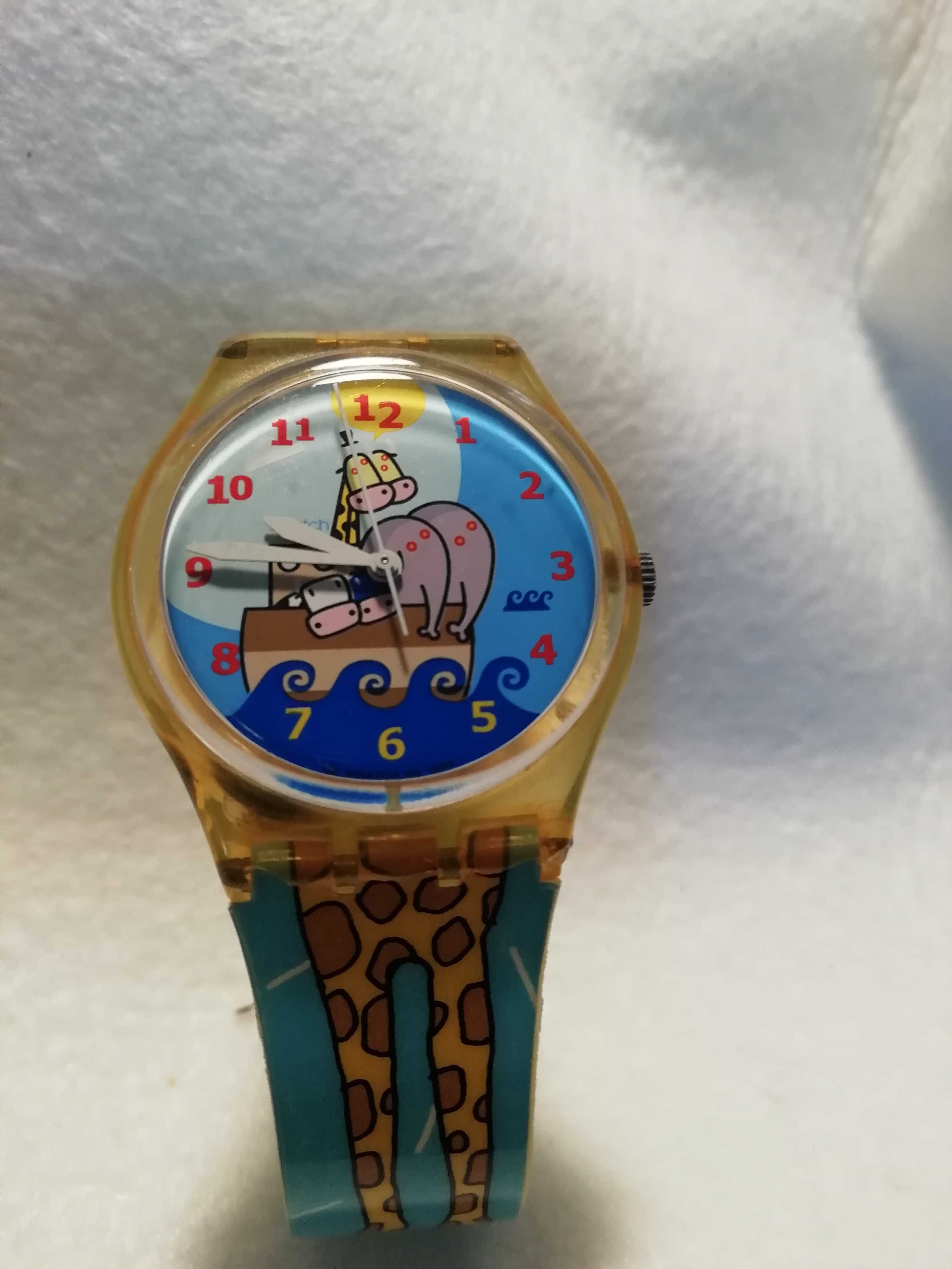 Relógio swatch	Fundo arca de Noé e bracelete com girafa. Como Novo !!