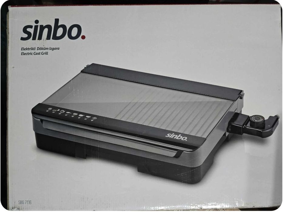 Gril elektryczny ze szklaną pokrywą .