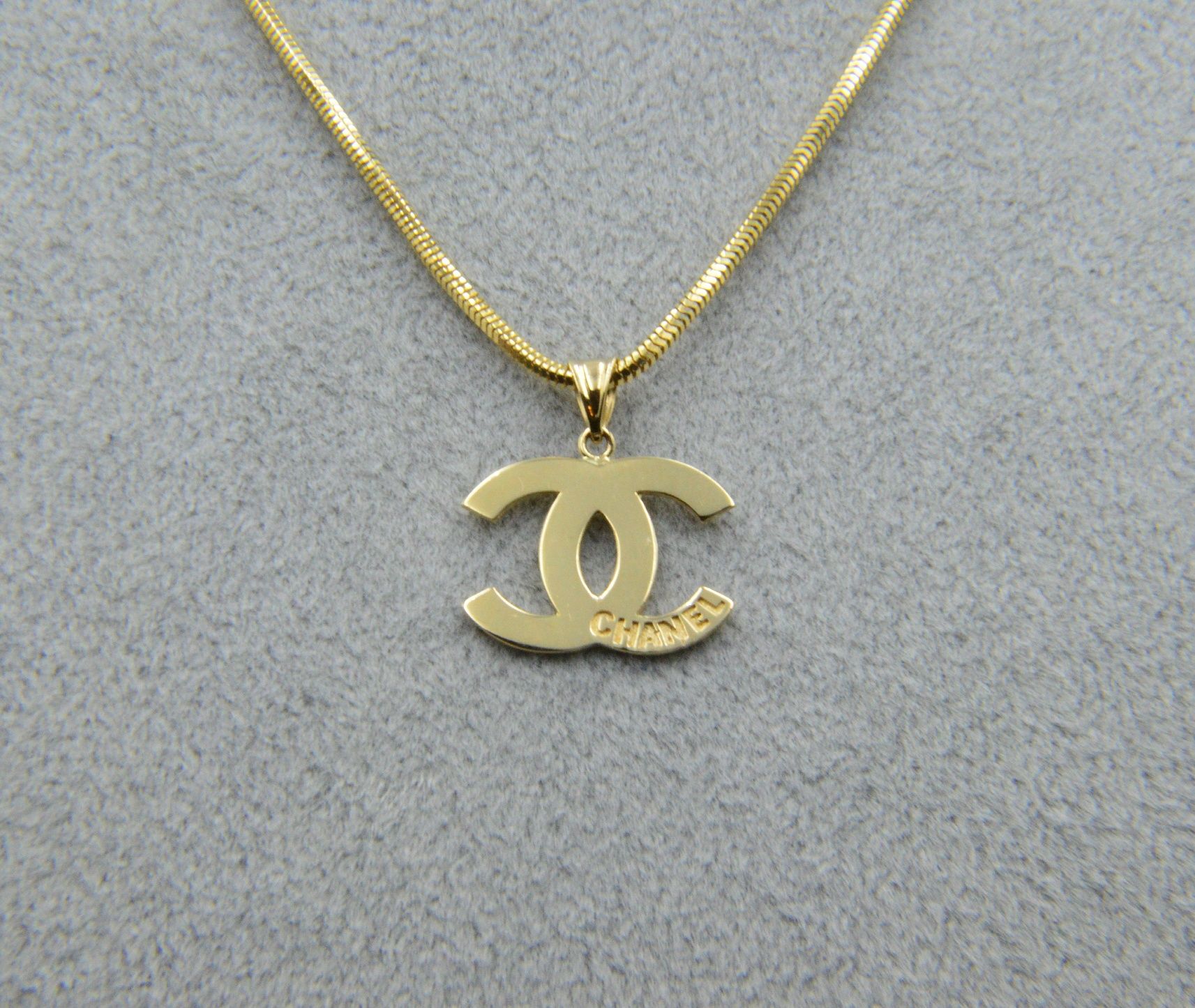 Nowa złota zawieszka Chanel CC 15x11 mm 0.74g 585