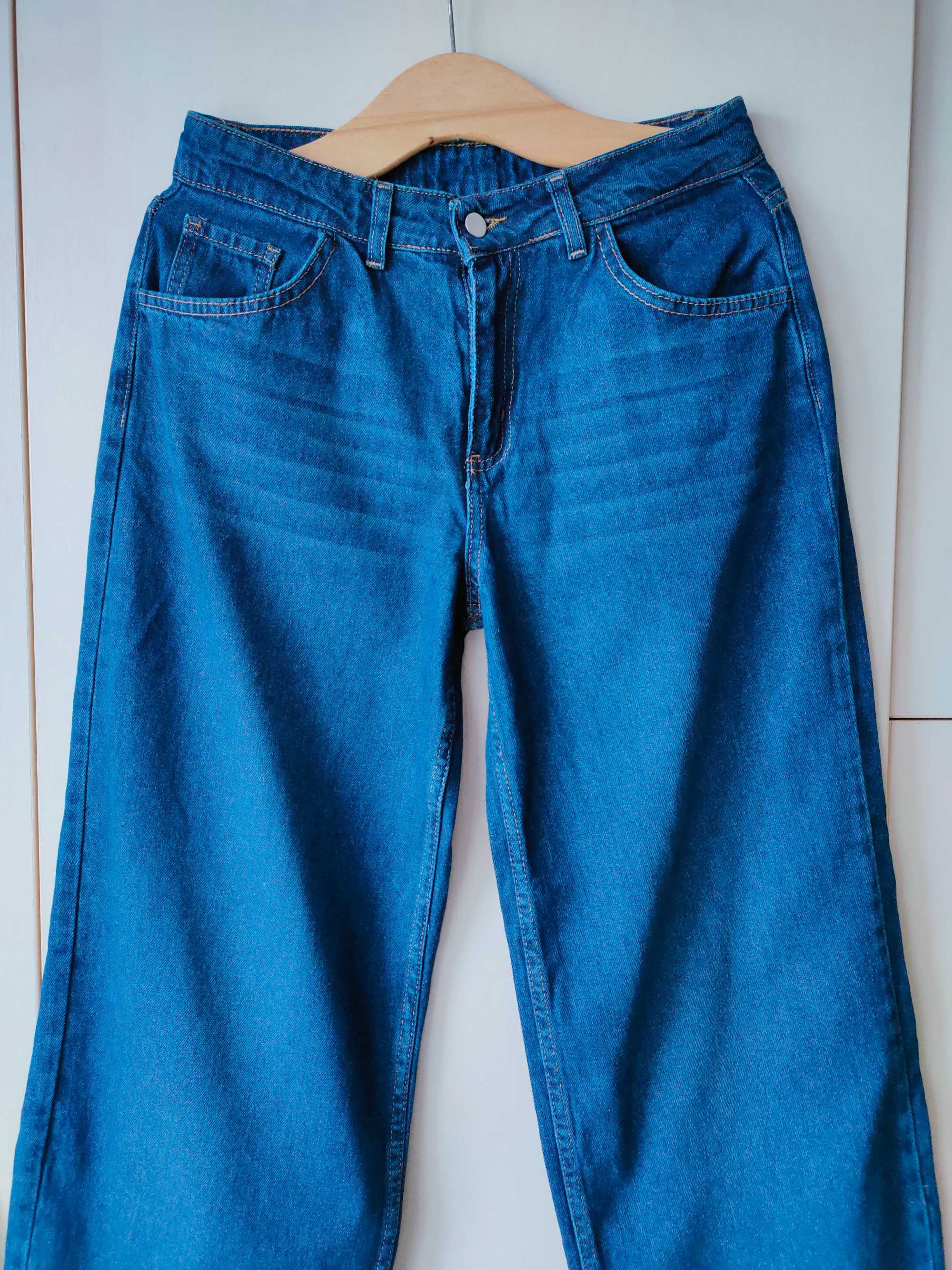 NOWE, niebieskie jeansy z przetarciami r. 40 (L)