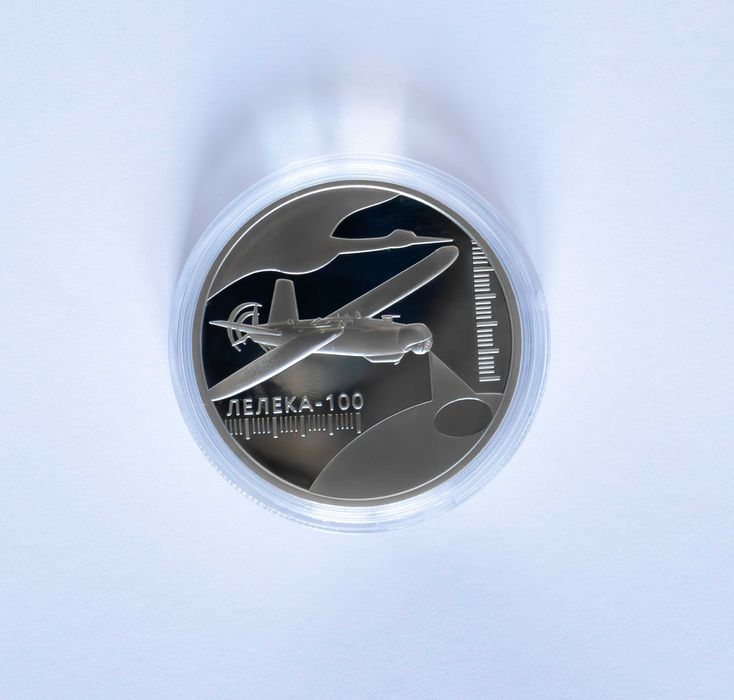 Монета "Українська бавовна. Лелека -100" у круглій капсулі