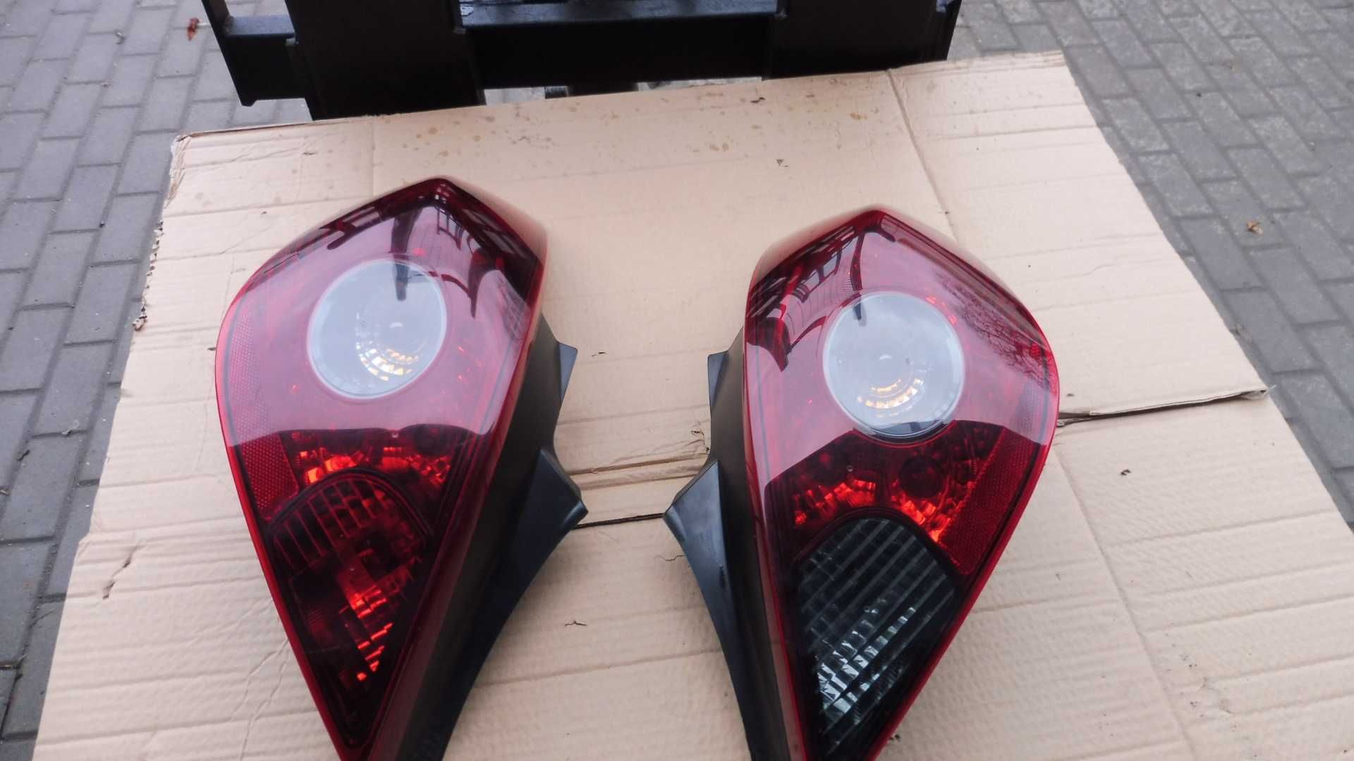 Opel Corsa  D OPC Lampy tył tylnie ciemne  orginał komplet