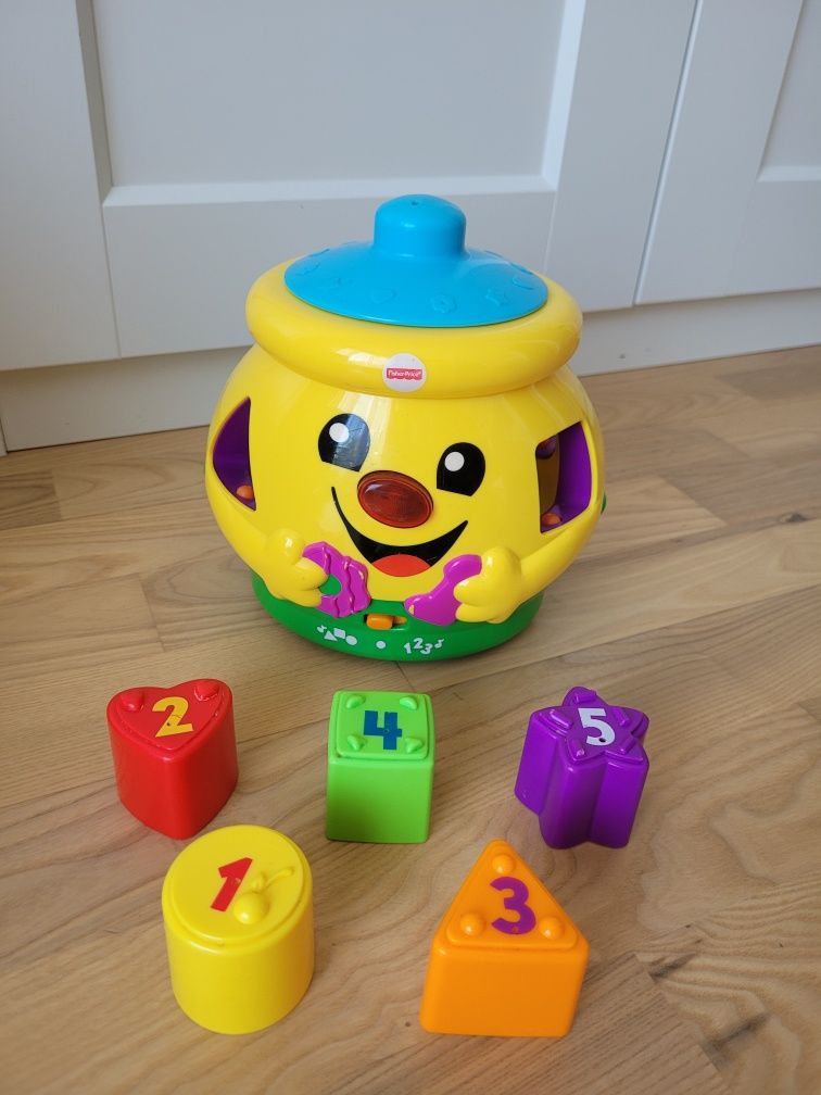 Garnuszek na klocuszek Fisher Price