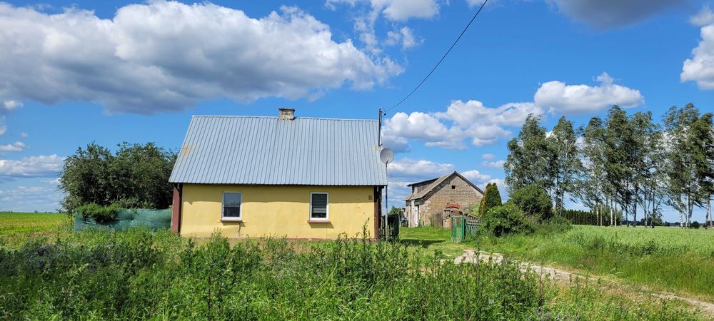 Siedlisko z budynkiem mieszkalnym i gospodarczym + działka budowlana