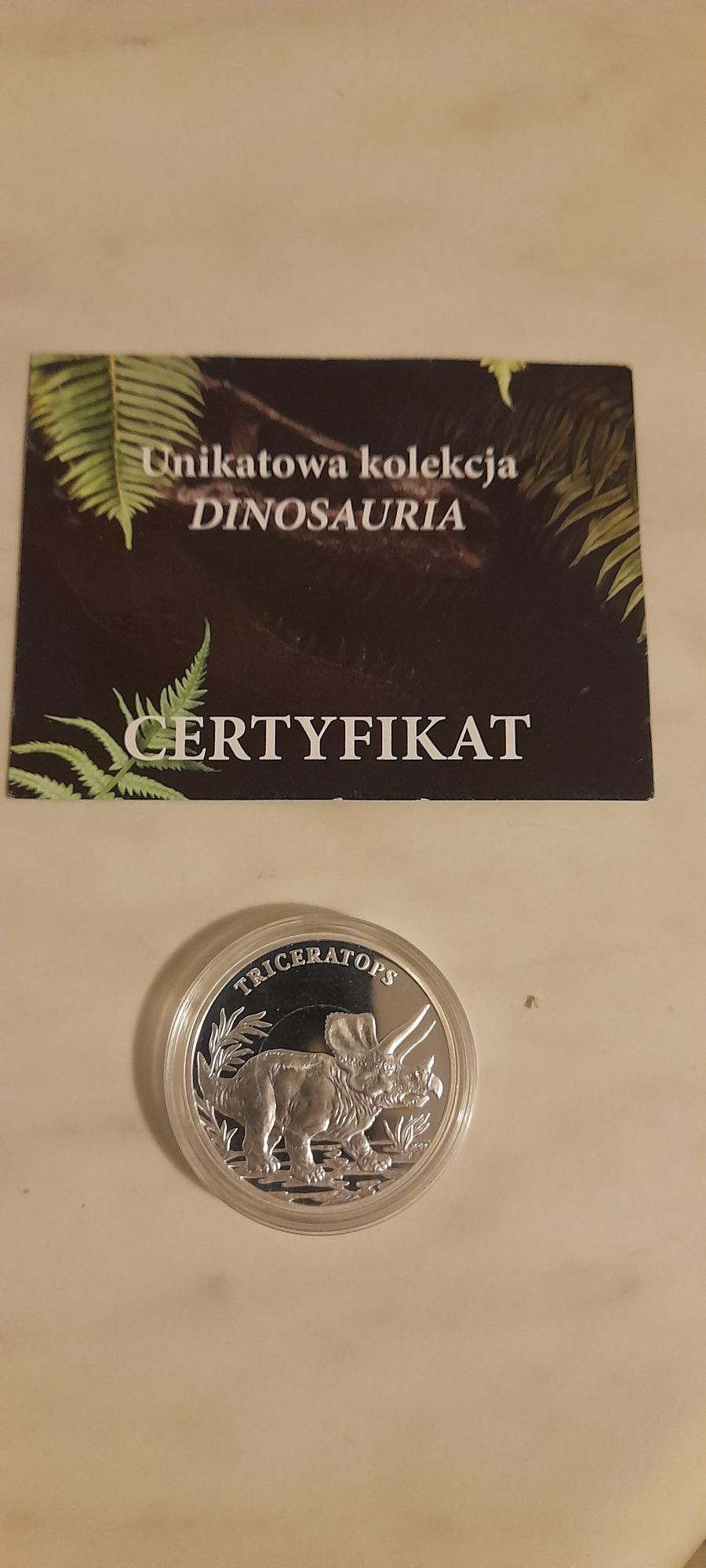 Srebrna kolekcjonerska moneta dinozaur