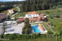 Quinta excecional com 8 quartos, piscina ampla e espaços exteriores tr