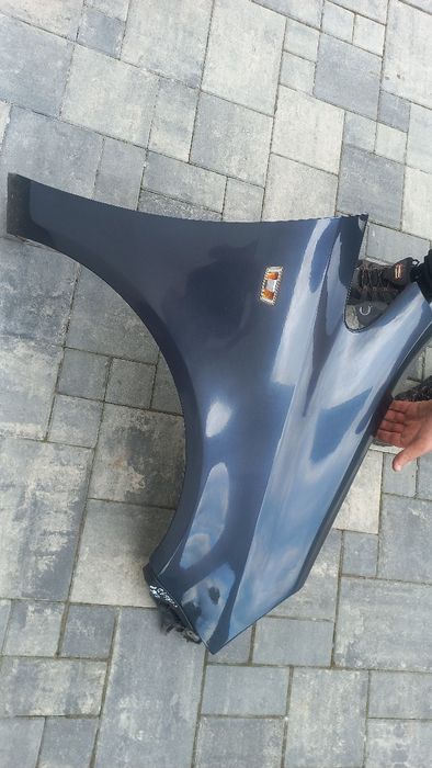 Opel Corsa d blotnik przedni prawy z168