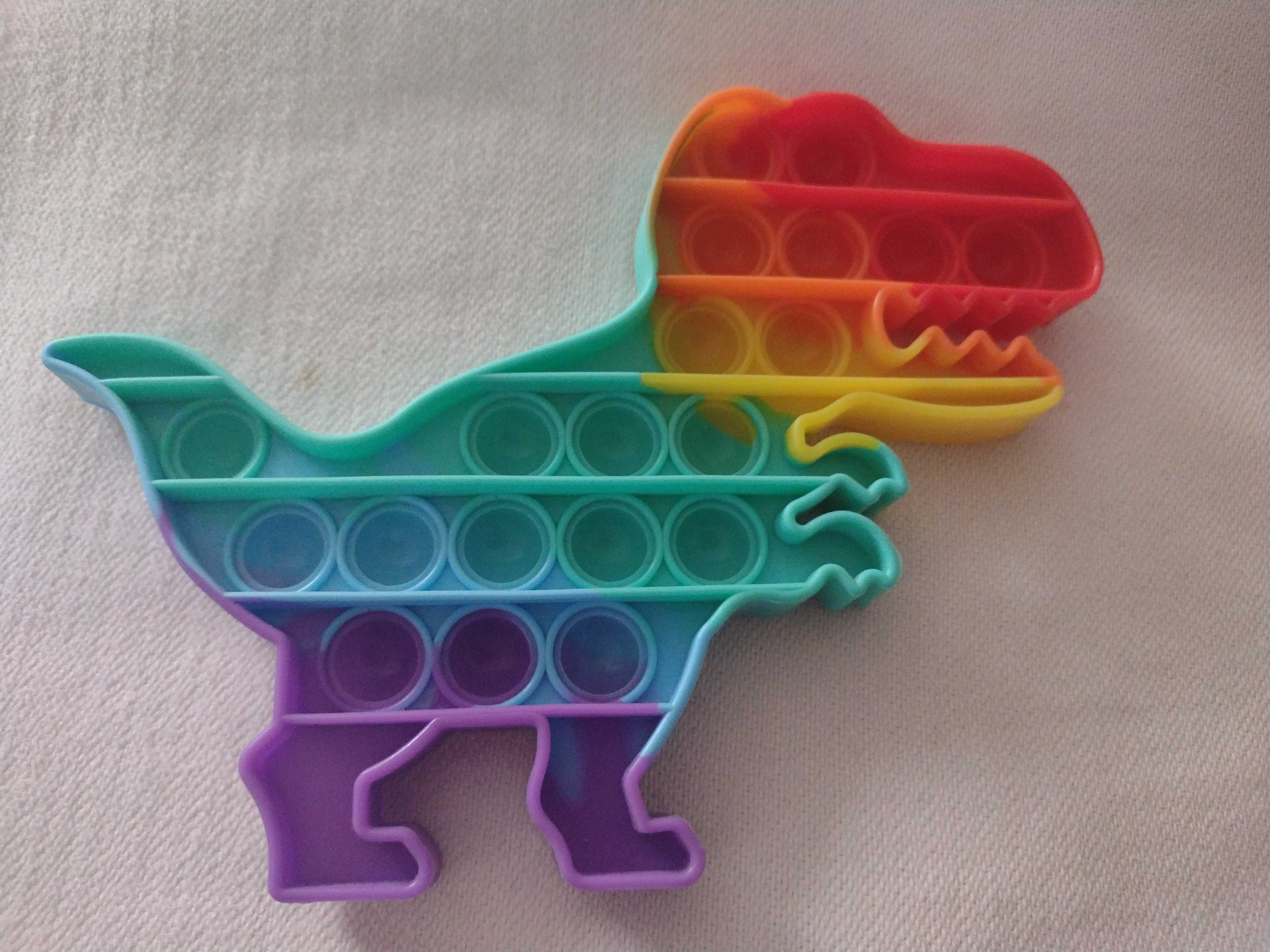 zabawka SENSORYCZNA PUSH BUBBLE POP IT. Dinozaur. Stan idealny
