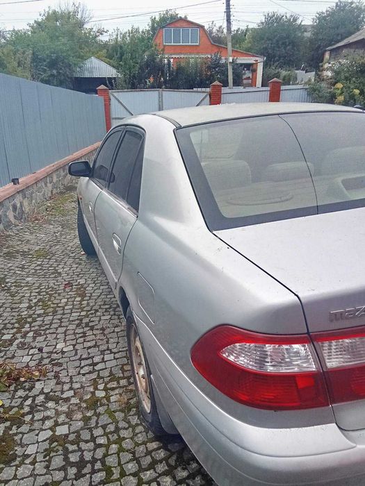 Продам авто Mazda 626 2 літра 2000 рік сірий бензин на ходу