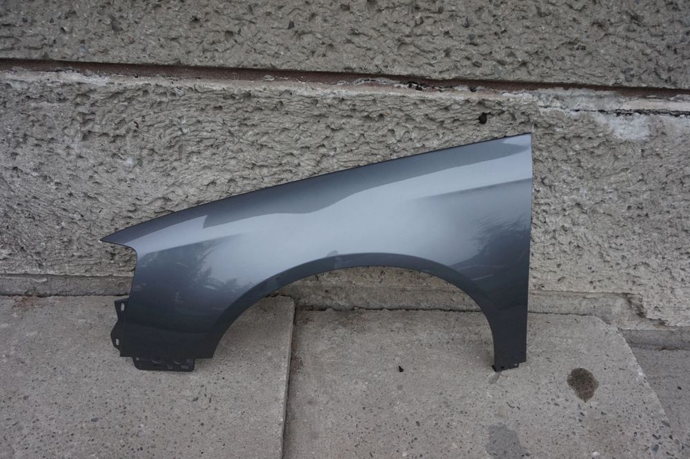 BŁOTNIK PRZEDNI LEWY VW PASSAT B6 LA7T