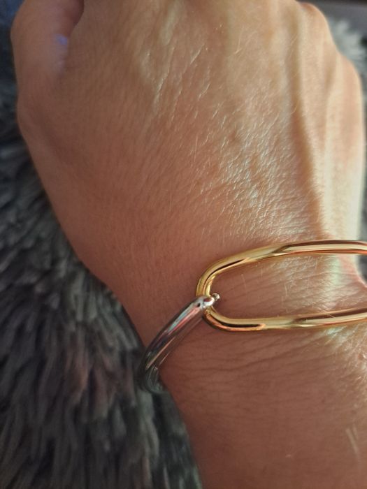 Pulseira em aço prateado e dourado