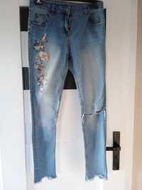 Spodnie damskie - jeans - niebieskie - roz. 40 -