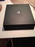 PlayStation 4 PRO 1TB HDD, 4K + 2 pady z ładowarką + 12 gier