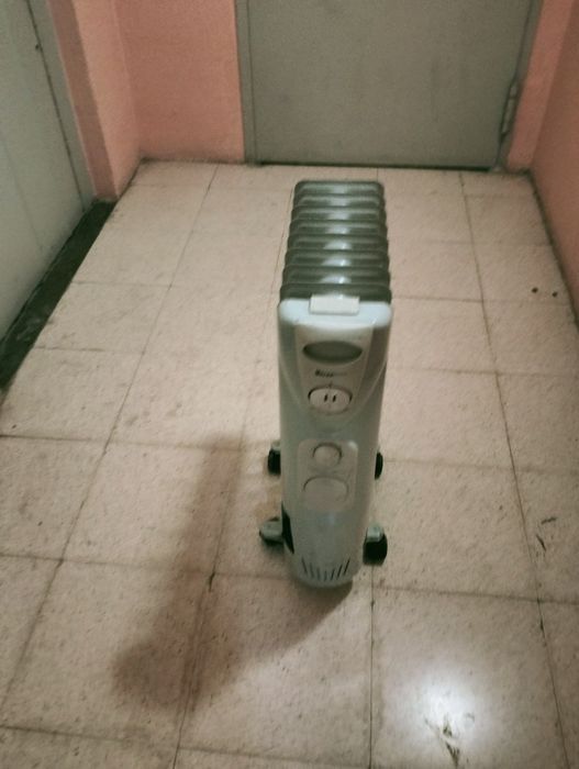 Aquecedor a oleo com  oito varas