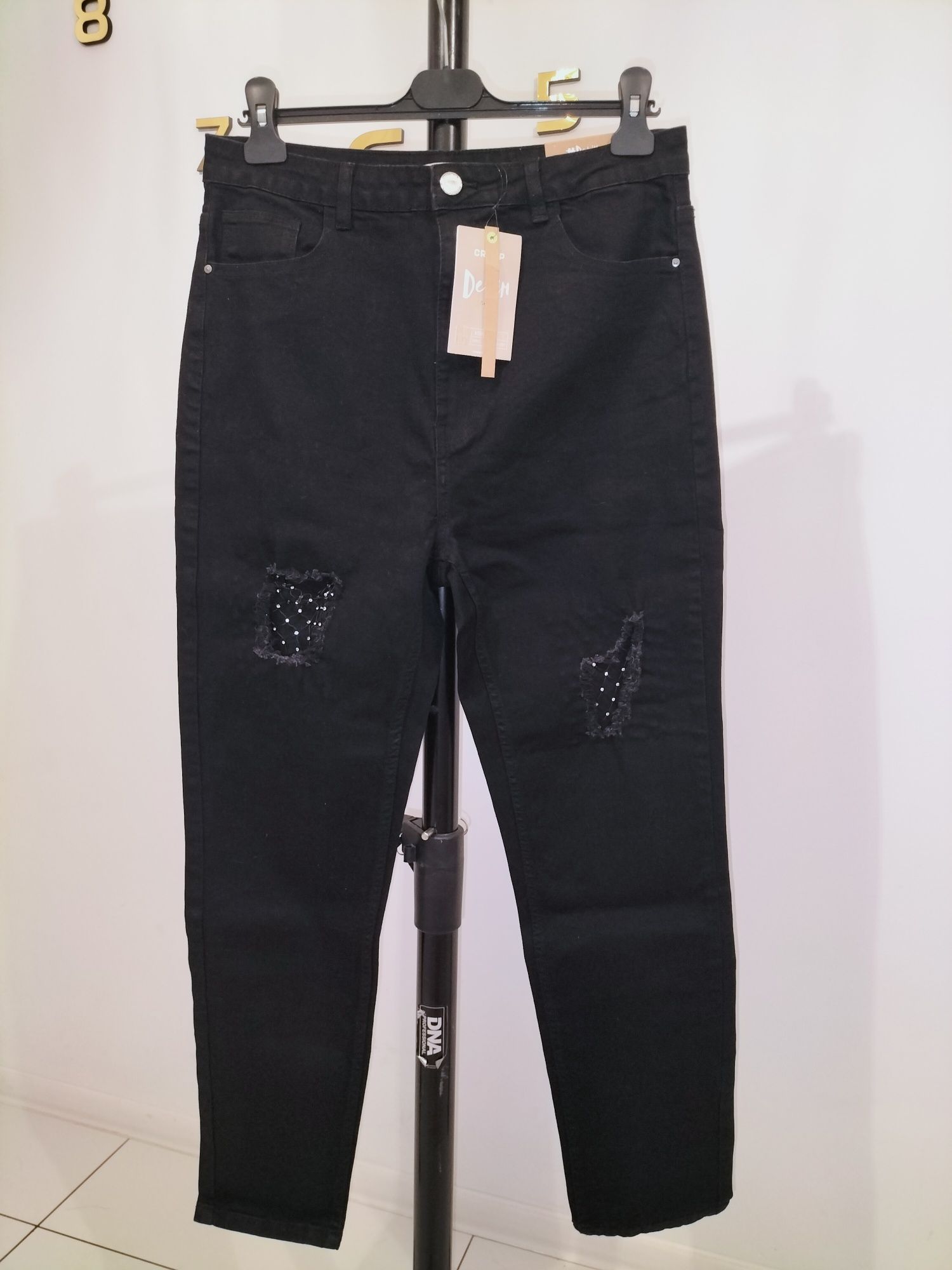 Nowe jeansy Cropp 42