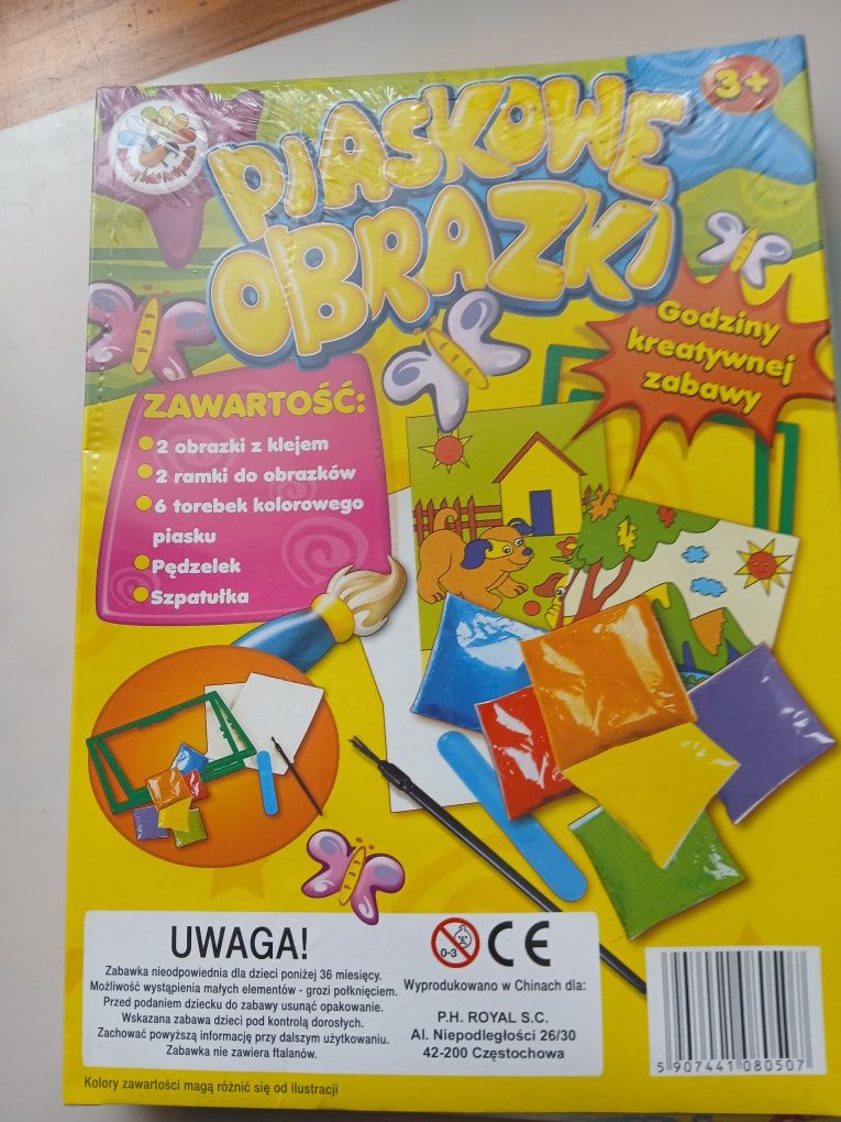 Piaskowe obrazki. Nowa w folii.