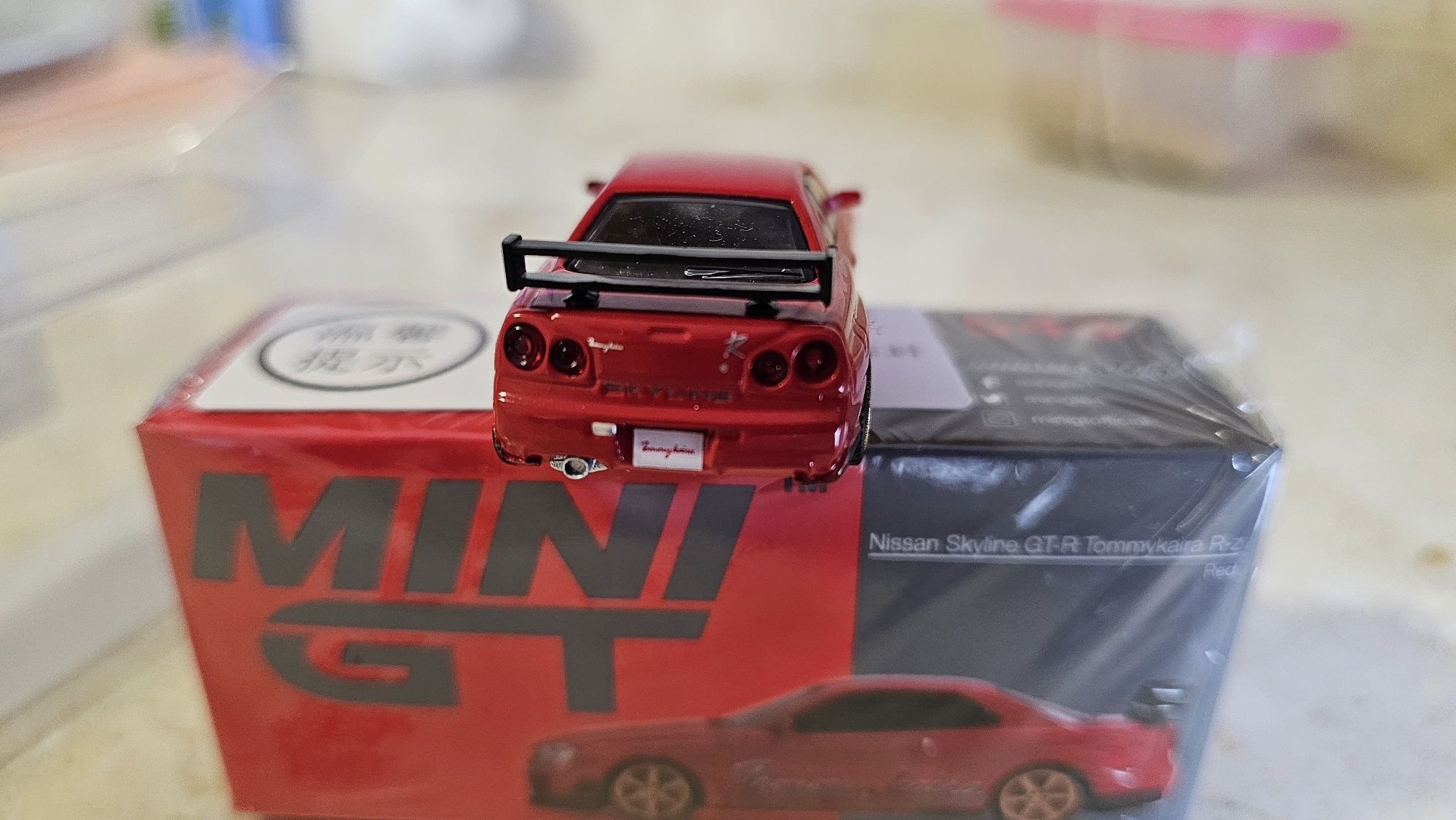 Mini GT 543 Nissan Skyline GT-R (R34) Tommykaira R RZ Edition Red