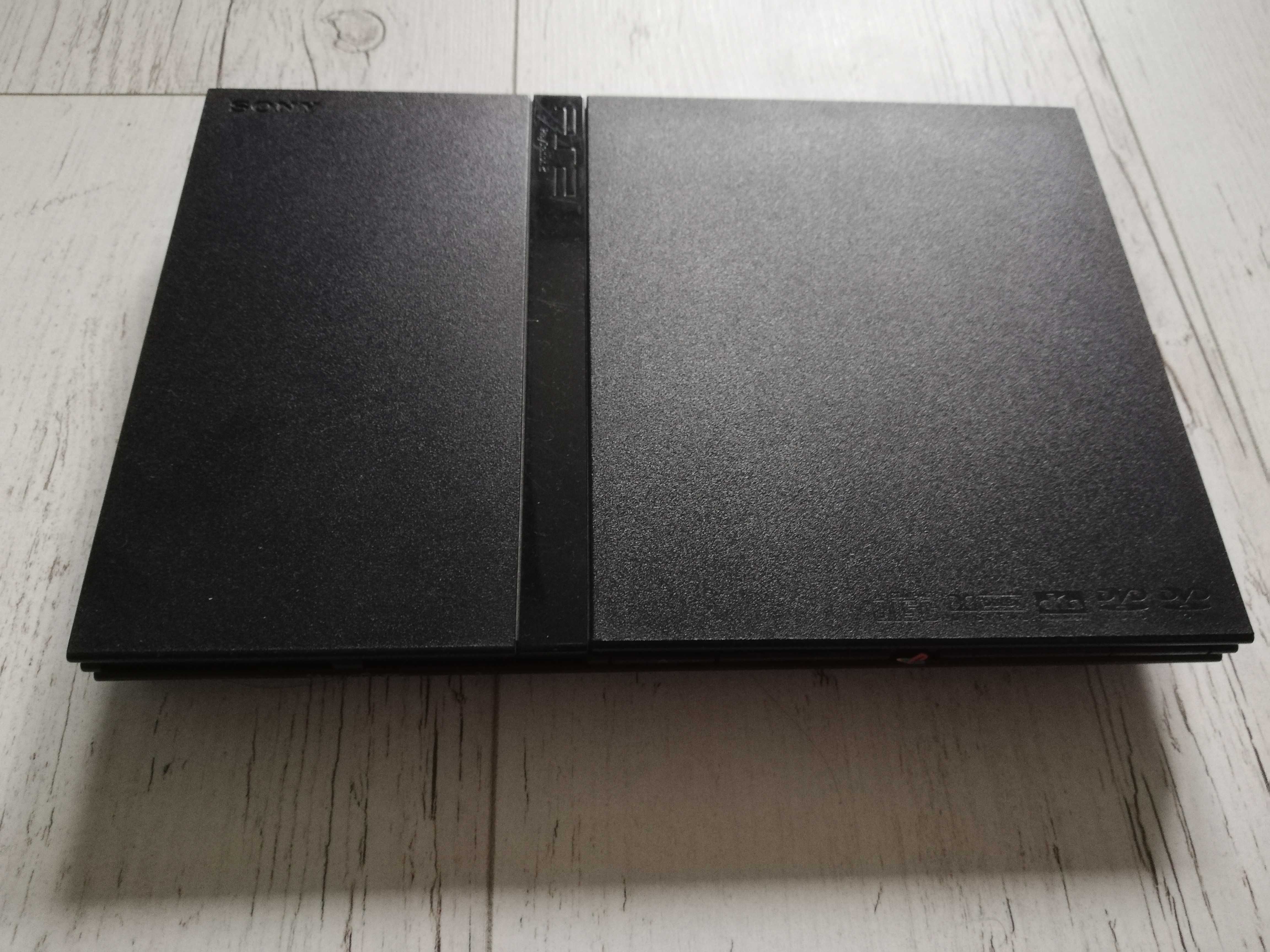 Konsola PlayStation 2 slim + pad + 2 memorki + kabel Component + 4 gry