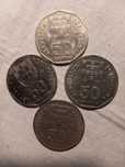 4 moedas de 50 escudos.