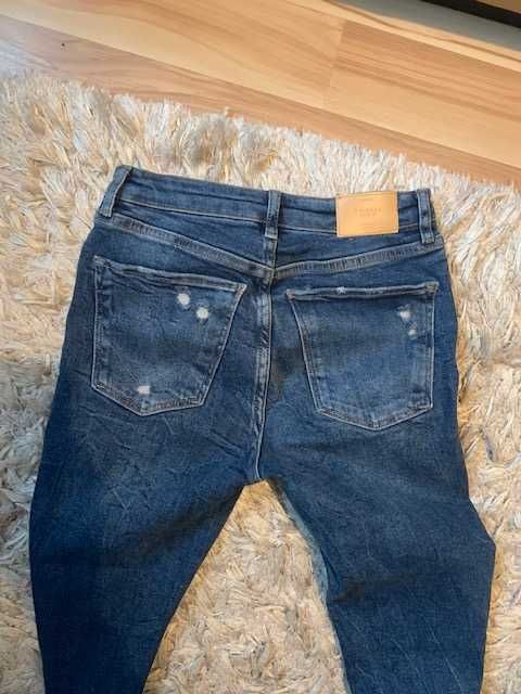 Spodnie jeansy BERSHKA jak nowe roz. 34