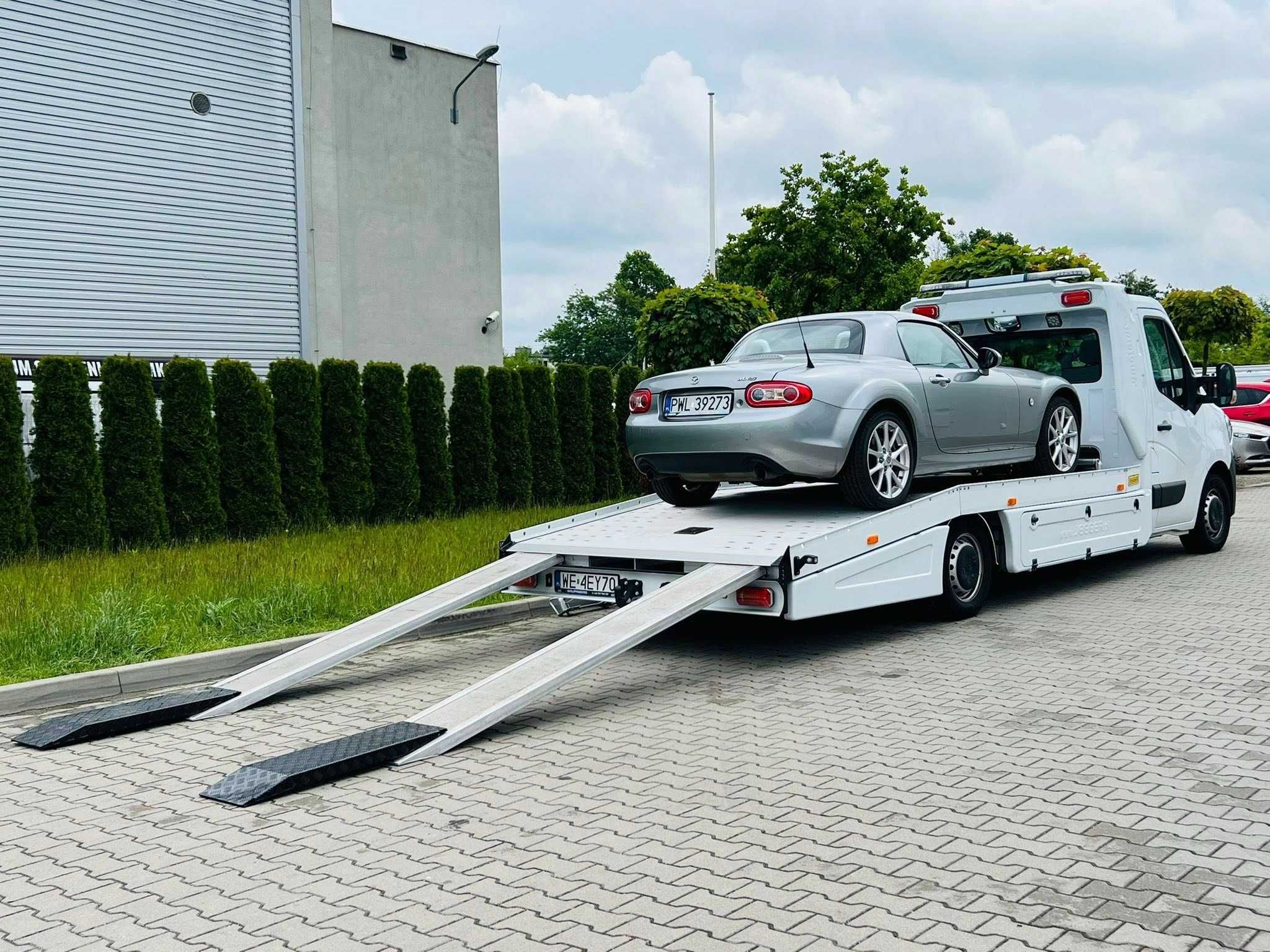Pomoc drogowa transport holowanie hol auto zastępcze W-wa Grodzisk Maz
