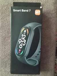Блютуз часы Smart band 7 с розовым ремешком.