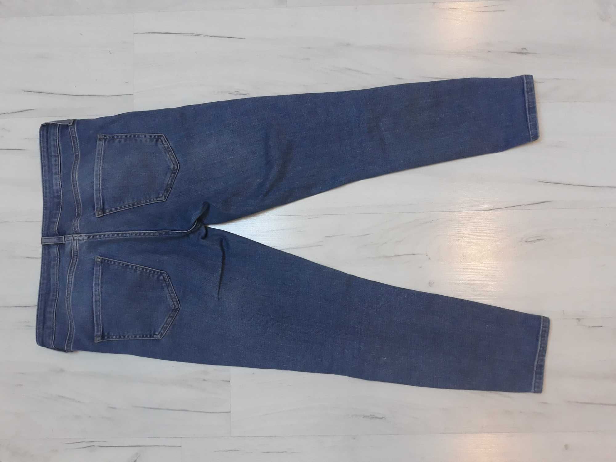 spodnie jeans top shop z dziurami