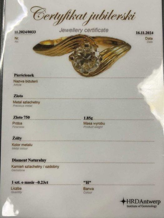 Złoty pierścionek z brylantem 0.23 ct