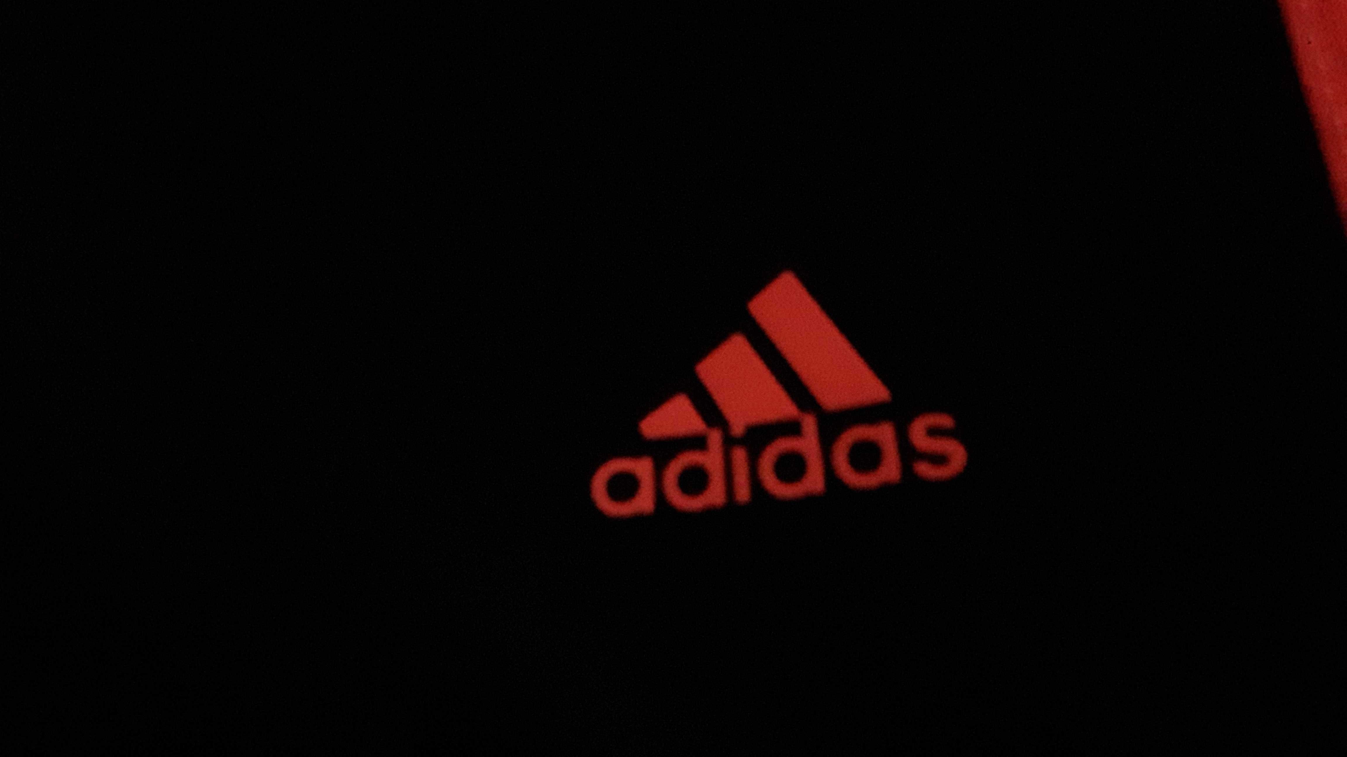 Leginsy jak nowe Adidas 3/4 czarne z pomarańczowymi paskami, r. S