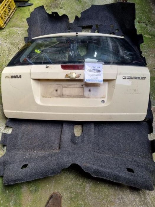 tampa da mala Chevrolet Nubira 2009