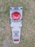 Kymco yup 50 blotnik tył lampa mocowanie tablicy