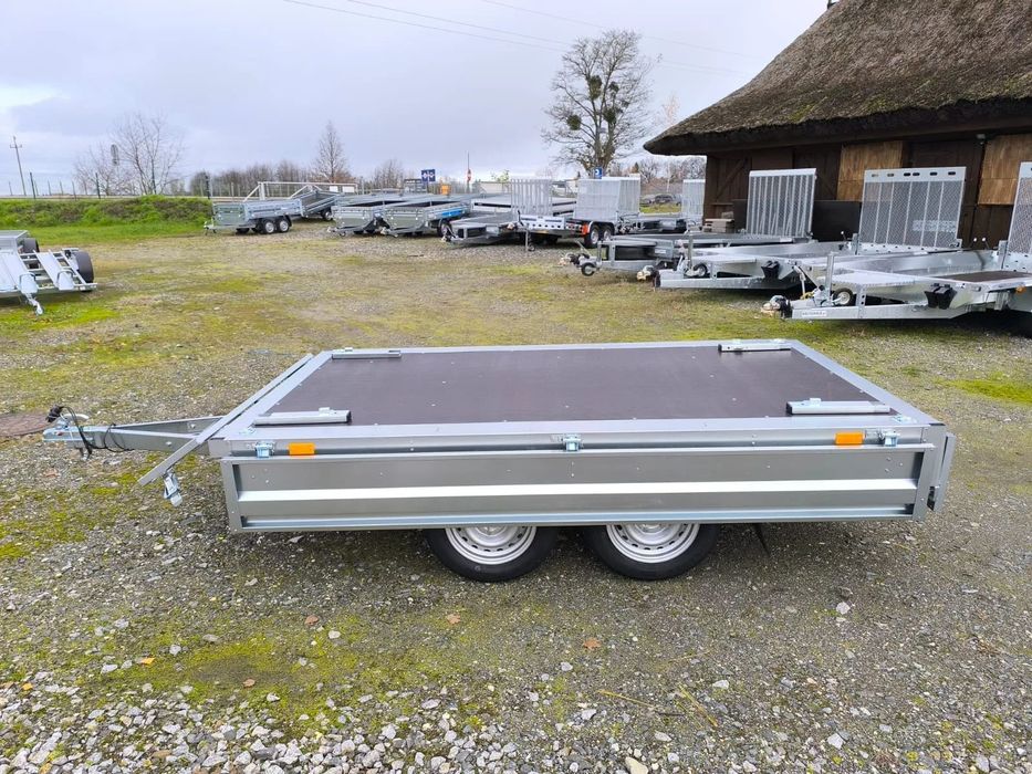 Neptun Przyczepa Neptun N7-263 2 KPS BASELINE 263x145x30 2 osie 750 kg koła pod spodem platforma  Nowa przyczepa Neptun 263x145x30 2 osie DMC 750kg Częstochowa dostawa