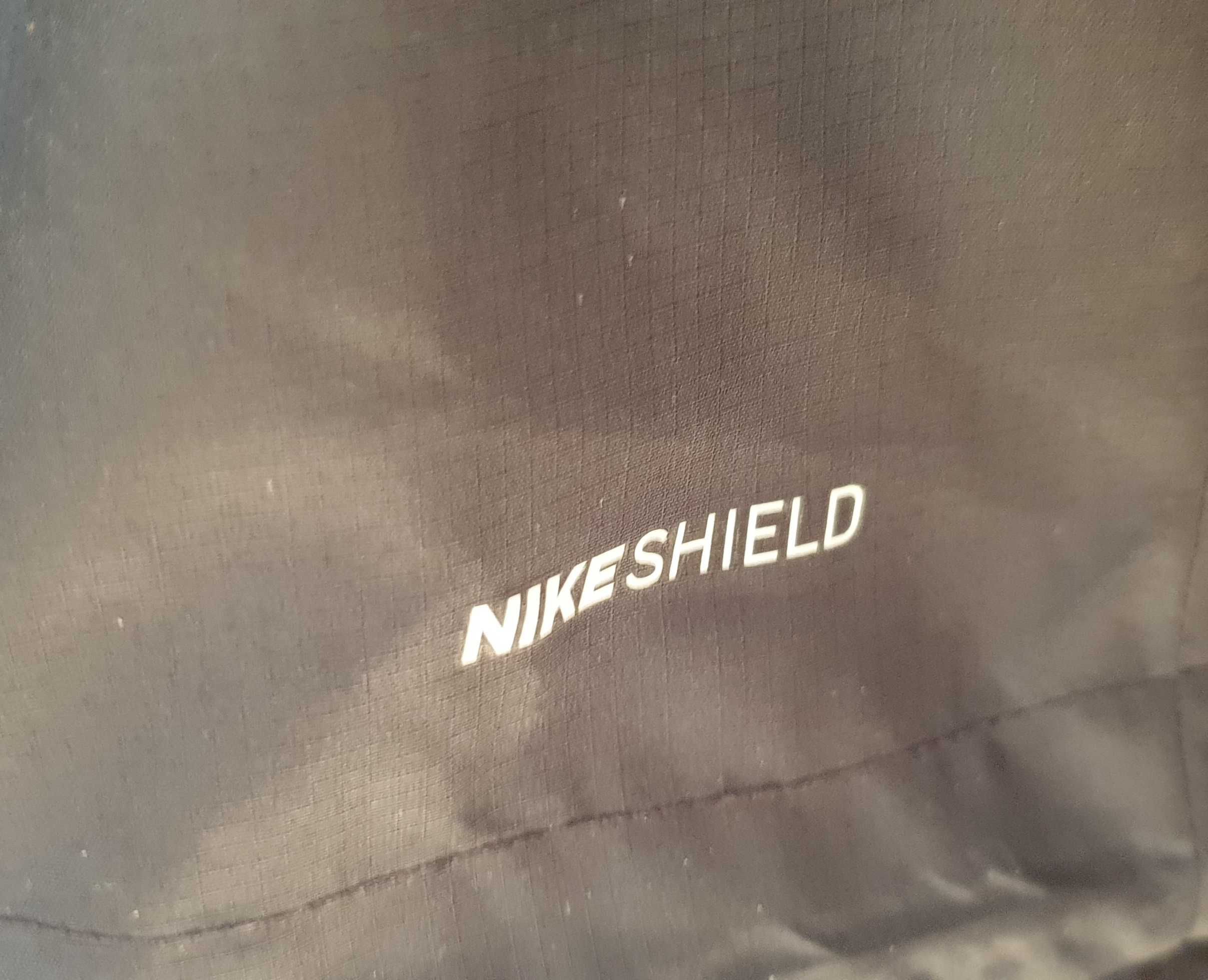 Oryginalna damska kurtka wiatrówka sportowa Nike Shield