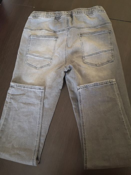 Spodnie jeansy  szare 170 rezerwed