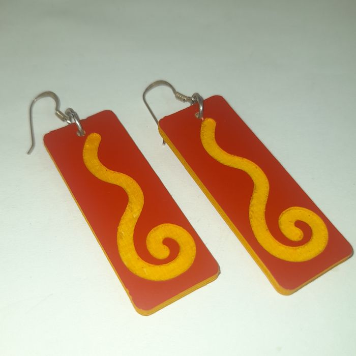 Wooden earrings in the shape of spirals.