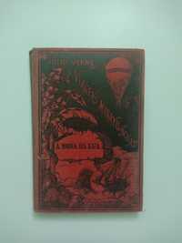 Livro "À roda da lua" de Júlio Verne com capa em relevo