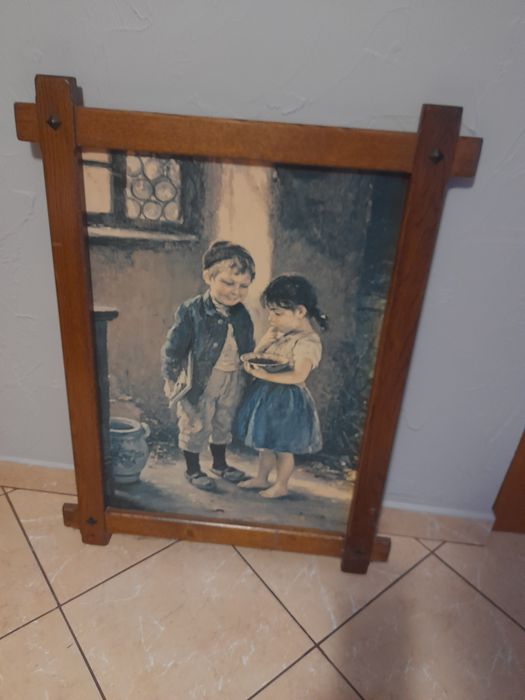 Sprzedam obraz w drewnianej ramię.