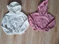 Dwie bluzy Reserved 122-128 napisy holo  stan idealny