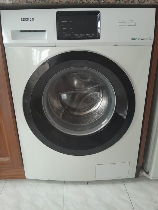 Sofa bed, washing machine and fridge